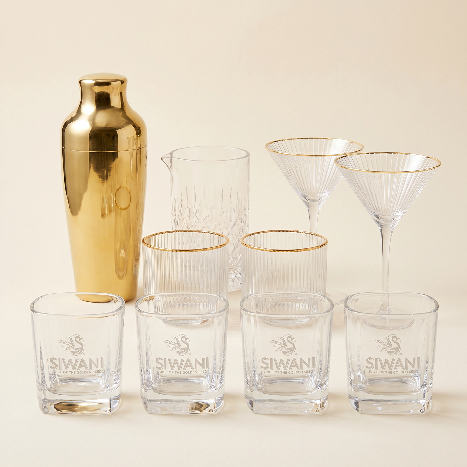The Founder's Toast — complete Siwani entertaining set with shaker, mixing glass, tumblers, martini glasses, and four Siwani ball glasses studio composite